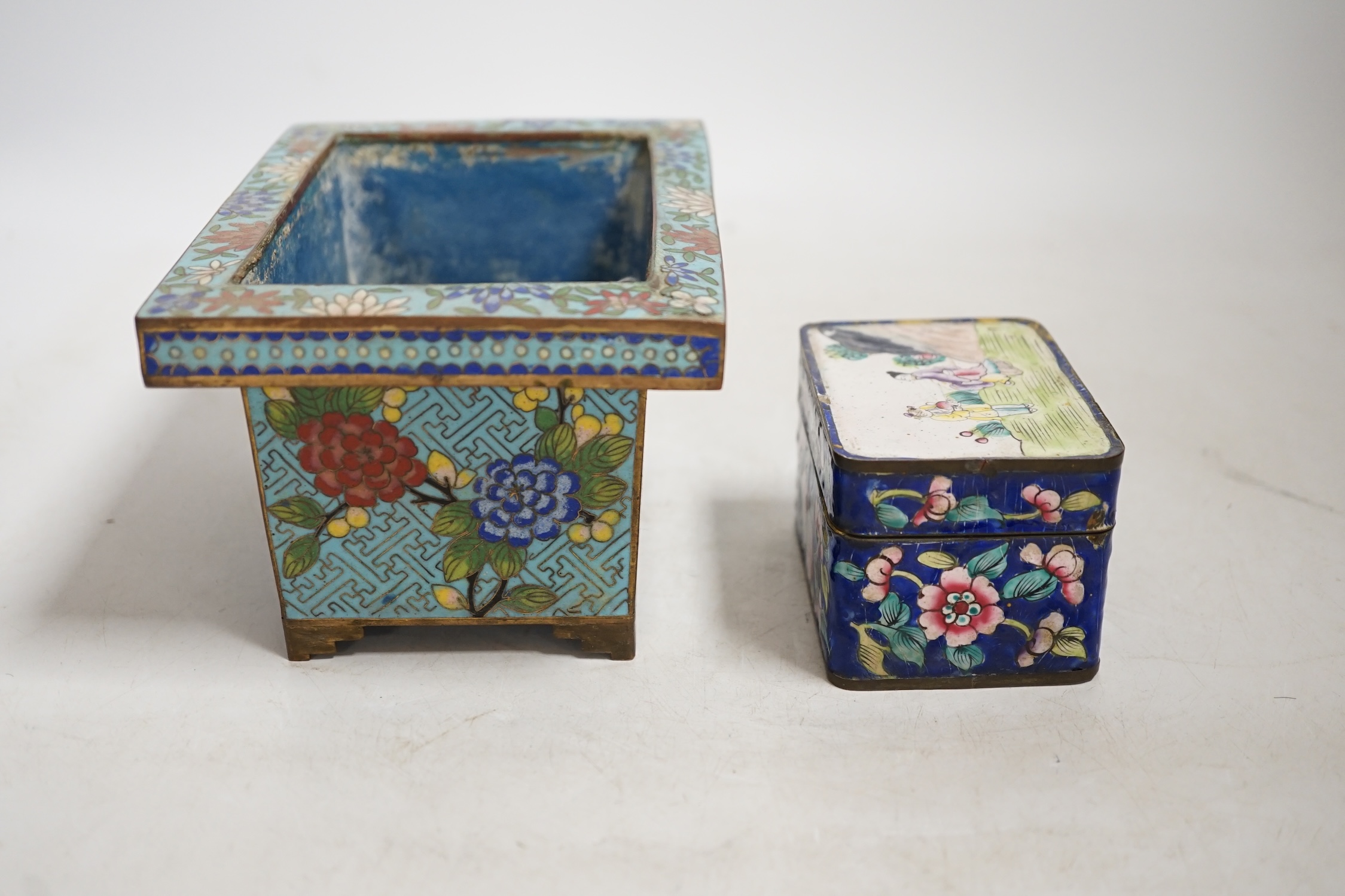 A Chinese cloisonné enamel floral jardiniere and a Canton enamel box and cover depicting two figures before a landscape, largest 16cm wide. Condition - poor to fair